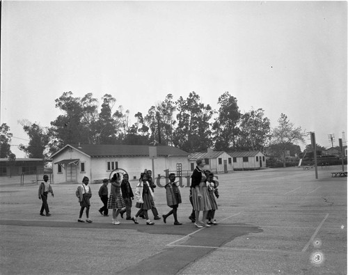 Children crossing school yard, Los Angeles, 1962