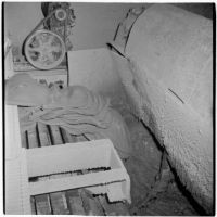 Clay slabs entering a mixing machine at the Universal Vitreous China Factory, Mentone, circa 1948