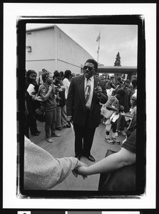 African American man speaking to an audience, Los Angeles, 1999