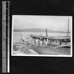 Guests disembarking from boat at Fukien Christian University, Fuzhou, Fujian, China, ca.1938
