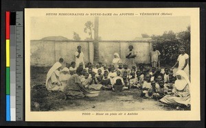 Women and children eating with missionaries, Togo, Africa, ca. 1920-1940