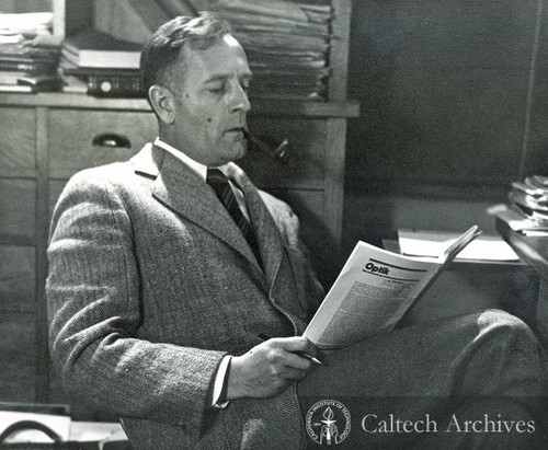Edwin Hubble reading at desk