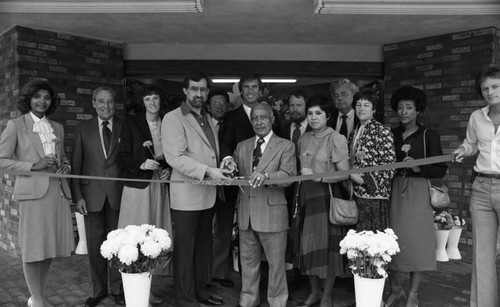 Gilbert Lindsay cutting a ribbon at the opening of a Conroy's Flowers franchise, Los Angeles, 1982