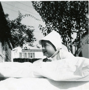 Phillip Martinez outside on a pillow, East Los Angeles, California