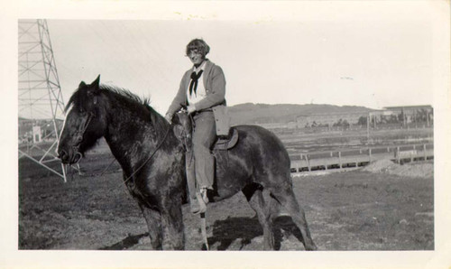 [Unidentified woman riding a horse in Visitacion Valley]