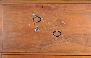Fall-front writing desk of black walnut, detail of inlay (front view)