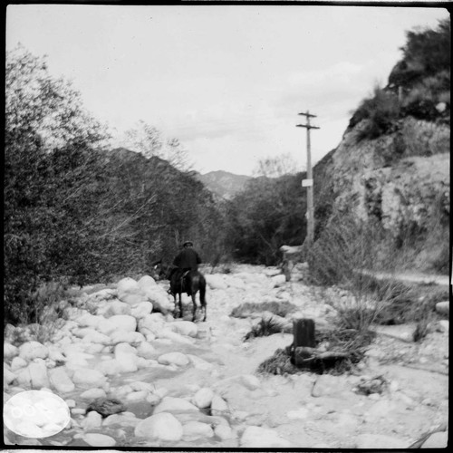 People riding horses in Santa Ana River Canyon along the transmission line