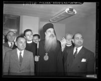 Patriarch Athenagoras, Archbishop of Greek Orthodox Church, with group of men in Los Angeles, Calif., 1948