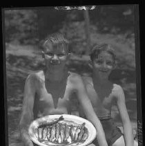 Two boys with fish