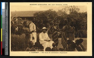 Missionary father gives a catechism lesson, Zagnanado, Benin, ca. 1900-1930