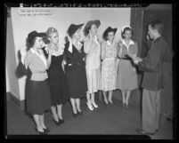 Capt. Robert L. Woods administers oath to the first Southland W.A.A.C. inductees, 1942