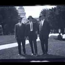 Three young men posed in Capitol Park
