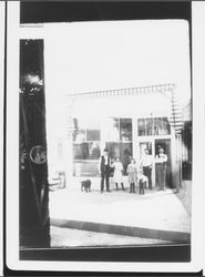 Men and children outside an unidentified Petaluma business