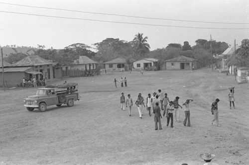 Group of men walking near a truck, San Basilio de Palenque, 1976