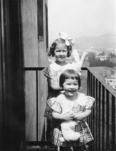 Sisters standing on the porch
