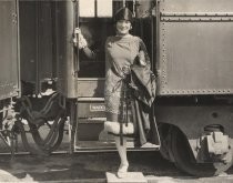 Woman stepping off a train