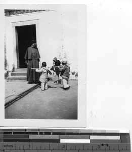 A Maryknoll Sister with children at Mexien, China, 1937