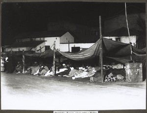 Flashlight - Persons asleep under a shelter