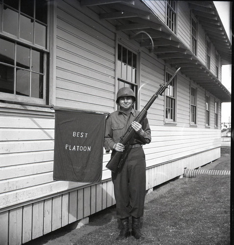 Williams posing with bayoneted rifle at Fort Ord