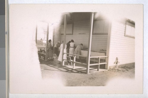 Spring, 1936, Kern County. Arvin Migratory Labor Camp - Washing facilities provided at the camp