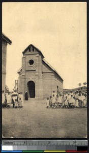 Congregation posing before a large brick church, Madagascar, ca.1900-1930