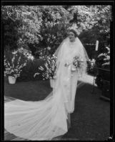 Charlotte Holden Hall Ford shows off her wedding gown, Montecito, 1935
