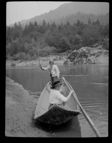 Sandy Bar Bob (Karok) and Grace Nicholson in canoe