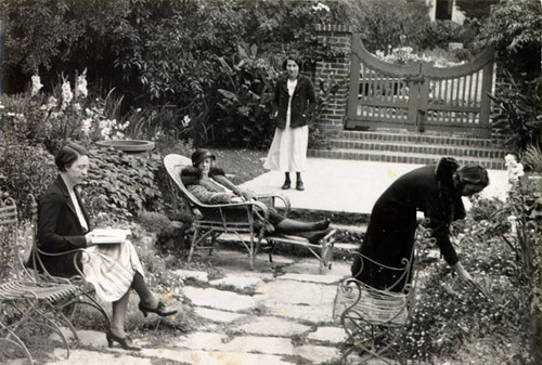 [Four women in a garden at the Ladies' Protection & Relief Society]