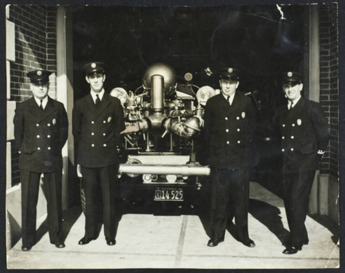 Engine Company No. 8, standing by engine in open apparatus bay of Station No. 8, 2nd & Claremont Ave