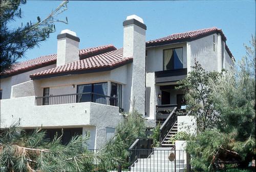 [La Mancha Townhomes model home exterior, plan 22 slide]