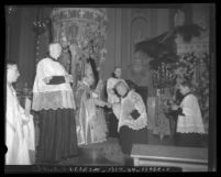 John Joseph Cantwell seated on throne with scepter at his elevation to archbishop ceremony in Los Angeles, Calif., 1936