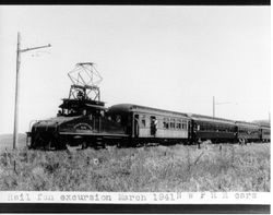 Petaluma and Santa Rosa Railroad Company freight motor number 506 pulling four Northwestern Pacific cars on a railfan special