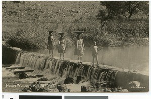 Native women crossing river, Africa