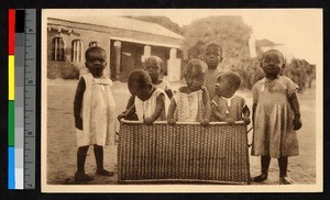 Young orphans outside in a wicker basket, Congo, ca.1920-1940