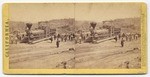 [View of locomotive and trestle in background]