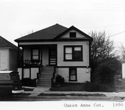 Small Queen Anne cottage with fish scale shingles