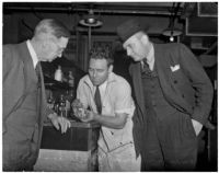 Coroner Frank Nance, chemist Miles Drake, and Det. Lt. Aldo Corsini examining something in a chemistry lab, Los Angeles, 1930s