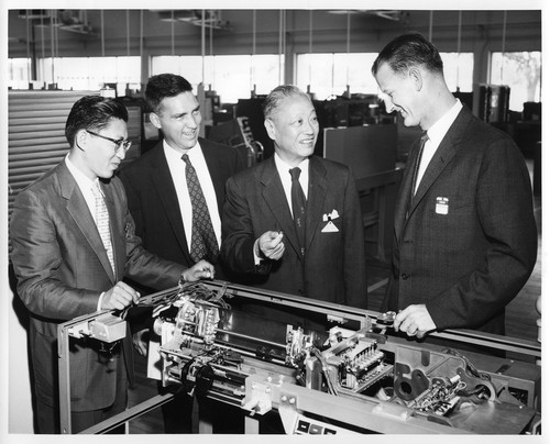 Businessmen Inspecting the Interior Mechanisms of an IBM Data Processing System
