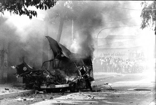 Bus on fire, San Salvador, 1982