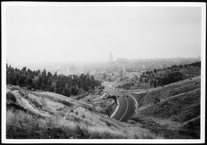 Panoramic view of the completed lanes of North Figueroa Street, looking south from Spruce Street, showing hills in the foreground, ca.1936