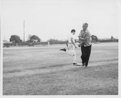 Charles Casassa, S.J., in baseball game