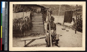A Gabonese Christian in front of his house, Gabon, ca.1900-1930