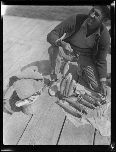 Actor Rod La Rocque with fish, Lake Arrowhead, 1929