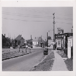Courtland Avenue looking toward Foothill Boulevard in the Fairfax district of Oakland, California. Black and White Liquors on right