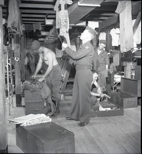 Trainees doing laundry in the barracks at Fort Ord