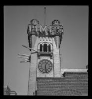 Clock tower of the old Los Angeles Times Building, being prepared for demolition, Los Angeles, 1938