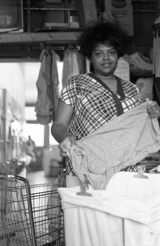 Woman at laundromat, Chicago, 1971