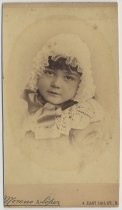 Portrait of child in lace bonnet