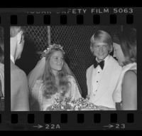Norman Chandler and bride, the former Jane Emilie Yeager, after their marriage ceremony. C. 1976