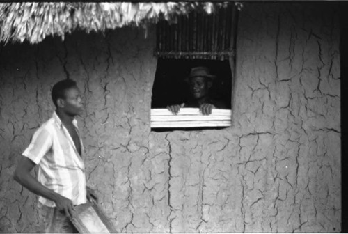 Two men work on a window, San Basilio de Palenque, 1975